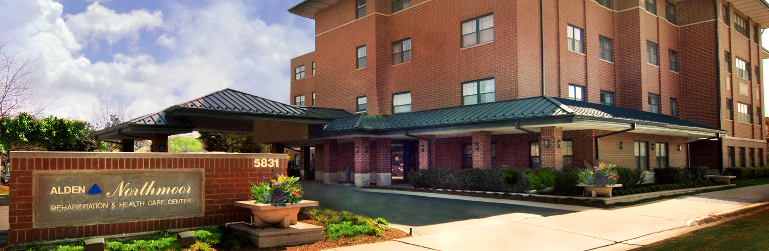 Healthcare center with brick facade and green landscaping.