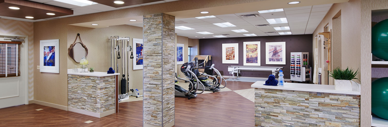 Modern exercise studio with equipment and decorative elements.